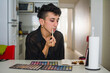 © Ana Luz Crespi/Stocksy - Gender queer latino make up routine