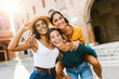 © Xavier Lorenzo - Multiethnic group of three happy young women having fun on summer vacation - Diverse female friends laughing together during their holidays - Multicultural united people concept