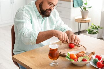 Sticker - Man preparing lunch in kitchen