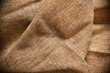 Folded rustic burlap hessian table cloth.