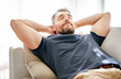 © C S W/peopleimages.com - Enjoying his day off. Shot of a handsome mature man relaxing on the sofa at home.