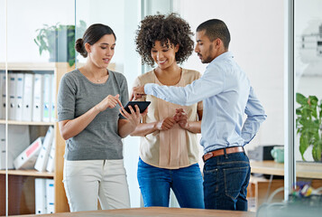 Aufkleber - Workplace mobility in action. Shot of office colleagues having a discussion over a digital tablet.