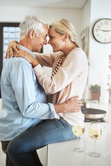 Poster - Their love grows everyday. Cropped shot of an affectionate mature couple sharing an intimate moment in their kitchen.