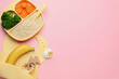 Healthy baby food and accessories on pink background, flat lay. Space for text