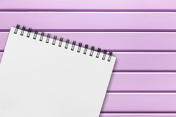 The paper white notepad on purple background.