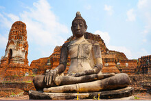 Buddha Image In Front Of The Main Pagoda Of Wat Mahathat Ayutthaya Historical Park, Thailand.                  