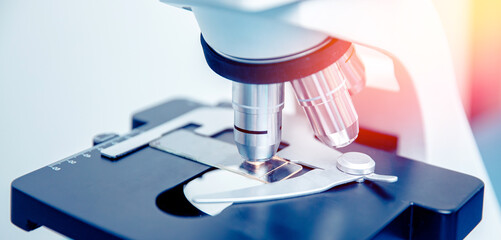 Wall Mural - banner panorama microscope with metal lens at laboratory, red and blue light. concept industry lab
