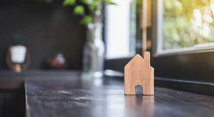 House model on wooden background