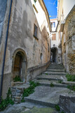 Fototapeta Panele - A narrow street among the old stone houses of Altavilla Silentina, town in Salerno province, Italy.	
