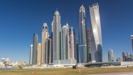 Wall Mural - Scenic view of Dubai Marina Skyscrapers with boats timelapse hyperlapse, Skyline, View from sea, United Arab Emirates