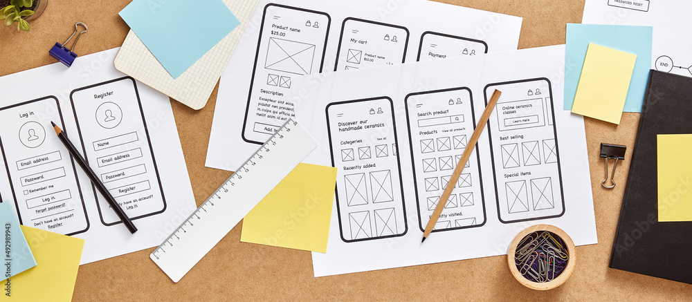 Keywords:
UI UX designer sketching mobile wireframes - Responsive web design concept banner. Web UX designer busy desk ...