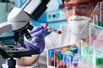 Wall Mural - doctor holding Blood tube sample for CBC Complete Blood Count test in hematology lab. Blood sample of patient for Complete Blood Count CBC test in microbiology laboratory