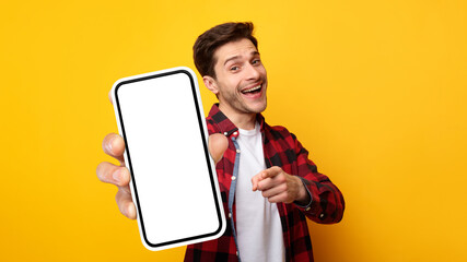 Poster - Excited guy pointing at white empty smart phone screen