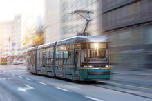 City Tram Rides Through The Streets Of The City At A Motion Speed Effect.