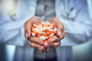 Poster - Get the treatment you need. Closeup shot of an unidentifiable doctor holding a variety of pills in her hands.