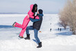© Andrey_Arkusha - Full length portrait of couple in love posing outdoors in winter