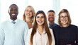 © Koegelenberg/peopleimages.com - They have come a long way together. Portrait of a group of confident work colleagues standing together against a white background.