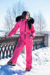 © Andrey_Arkusha - portrait of a young woman in a pink winter outfit with a fur hood