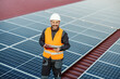 © Dusan Petkovic - Portrait of a supervisor testing solar panels on a tablet.