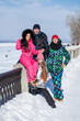 © Andrey_Arkusha - Young family of four walking outdoors in winter