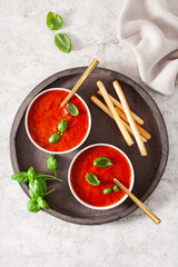 Wall Mural - tomato and bell pepper vegetarian soup on green background