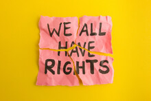 Text We All Have Rights Handwritten On Torn Paper Note