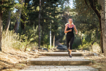 Wall Mural - Woman Running In Park At Summer Day