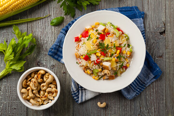 Wall Mural - Salad with rice, chicken, peanuts and vegetables. Top view.