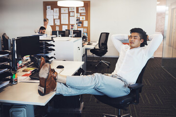 Poster - Time to take a break. Shot of a businessman taking a break in the office.