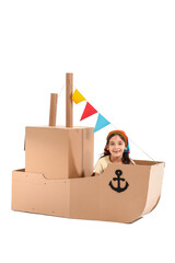 Sticker - Funny little girl playing with cardboard ship on white background