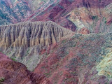 Fototapeta Tęcza - The exquisite multicolor mountains and rock formations surrounding the charming twon of Purmamarca, Jujuy province, Northern Argentina