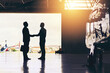© Ruan J/peopleimages.com - Welcome home. Full length shot of two unrecognizable businessmen shaking hands while standing in a hanger at the airport.
