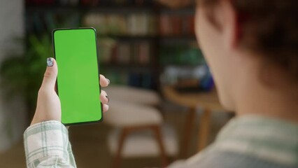 Tapping on Center Screen: Back View of Man at Phone with Green Screen for Copy Space. Chromakey Mock Up Without Tracking Markers. Close Up. Girl is Surfing Content Touching