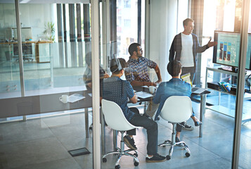 Poster - These numbers are strong. Shot of a young businessman giving a presentation in the boardroom.