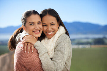 Wall Mural - Friedship that will last. Two young female friends standing happily in the outdoors.