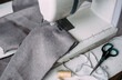 Sewing machine, accessories and fabric. Cozy creative sewing process at home