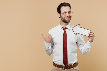 Young confused employee business man corporate lawyer 20s wear classic white shirt red tie glasses work in office showing aside with arrow point finger aside solated on plain beige background studio.