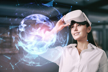 Poster - Attractive young european businesswoman with VR glasses using abstract polygonal sphere on blurry office interior background. Metaverse, cyberspace, augmented reality and future concept. 