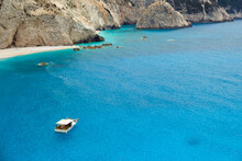 Landscape Of Lefkada Island, Greece. Impressive Azure Sea With Small Fishing Boat