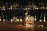 Fototapeta  - close up view of cigar and glass of whiskey on color back. 