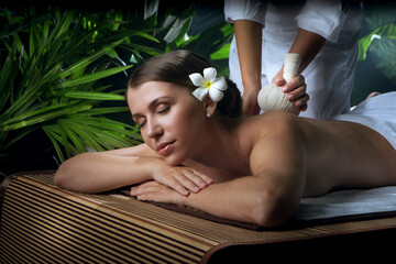 portrait of young beautiful woman in spa environment.  