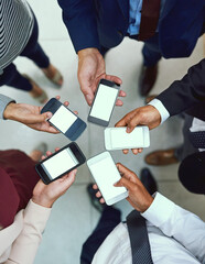 Aufkleber - Its one connected workplace. High angle shot of a group of unrecognisable businesspeople using their cellphones in synchronicity.