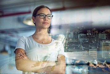 Canvas Print - Taking the city by storm. Multiple exposure shot of a young businesswoman superimposed over a city background at night.