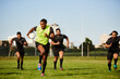 © Chanelle Malambo/peopleimages.com - They cant keep up. Full length shot of a diverse group of sportsmen playing a game of rugby during the day.