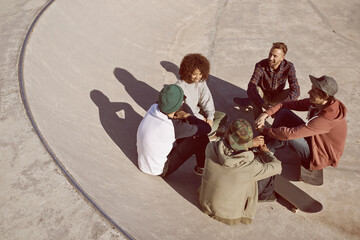 Poster - One of the guys. Shot of a group of friends hanging out in the sun at a skate park.