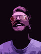 © monchak - Neon light studio close-up portrait of serious man model with mustaches and beard in sunglasses and white t-shirt