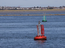 Red And Green Channel Marker Bouys In Sea