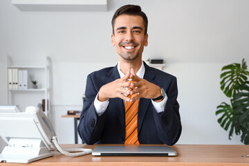 Poster - Handsome businessman video chatting at table in office