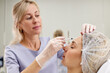 © Dmitry Borovikov/Stocksy - doctor giving face lifting injection