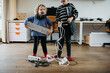 © Melissa Milis Photography/Stocksy - Children playing with electronic equipment